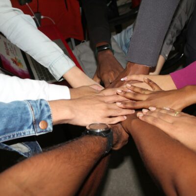 person wearing silver ring and white long sleeve shirt