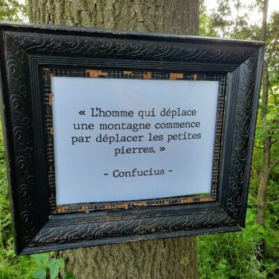Photo by Gatien Bataille - Lina Hadid a picture frame hanging on a tree in a forest